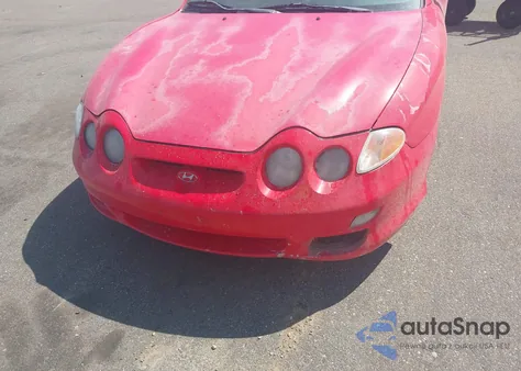 2001 Hyundai Tiburon Base Pkg 1 2 z USA, uszkodzony, nr VIN KMHJG25F71U226180